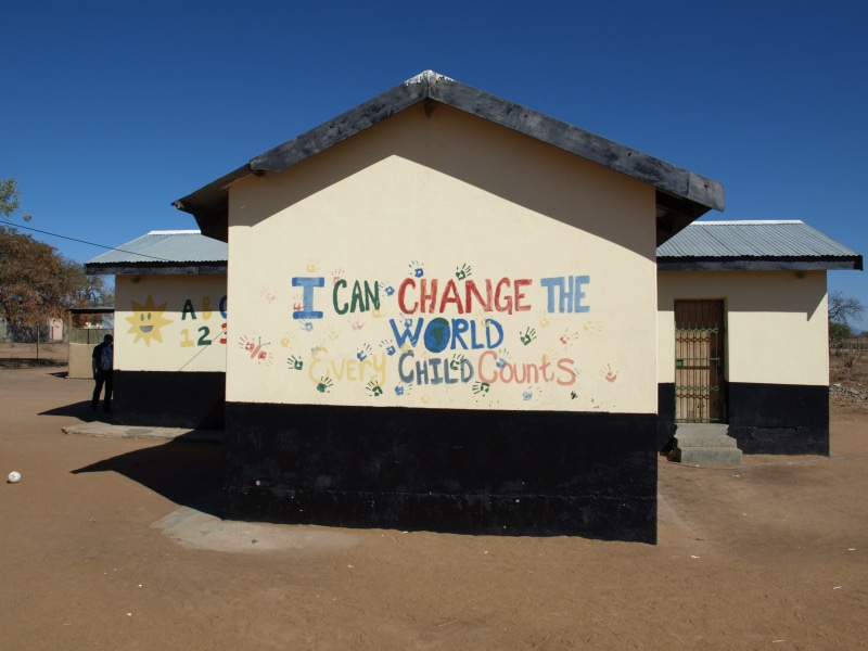 text, sign, Wall, shadow, Building, clear sky, South Africa, message, written, communication, sky, sunlight, graffiti, information, built structure, western script