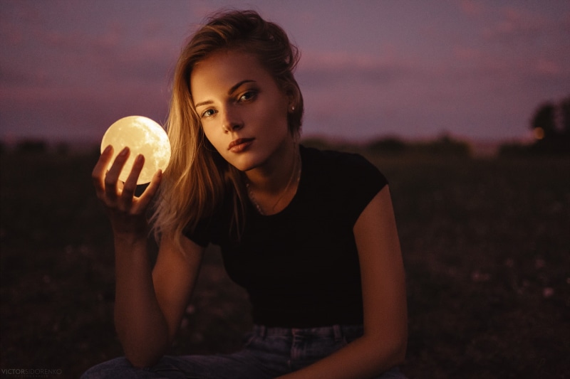 depth of field, women outdoors, outdoors, sitting, blonde, portrait, looking at viewer, jeans, 1080P, sphere, women, Anastasia Romanova, T-shirt, Victor Sidorenko