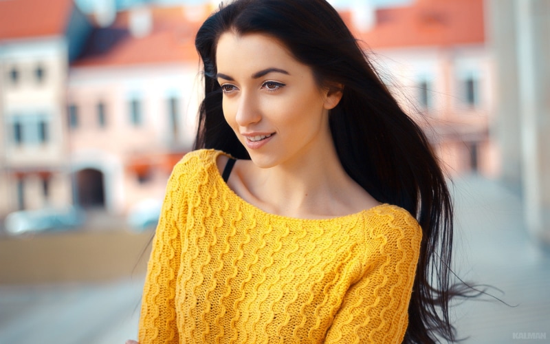 portrait, women, teeth, 1080P, focus on foreground, lifestyles, sweater, long hair, wavy hair, young women, model, black hair, face, Victor Kalman, city