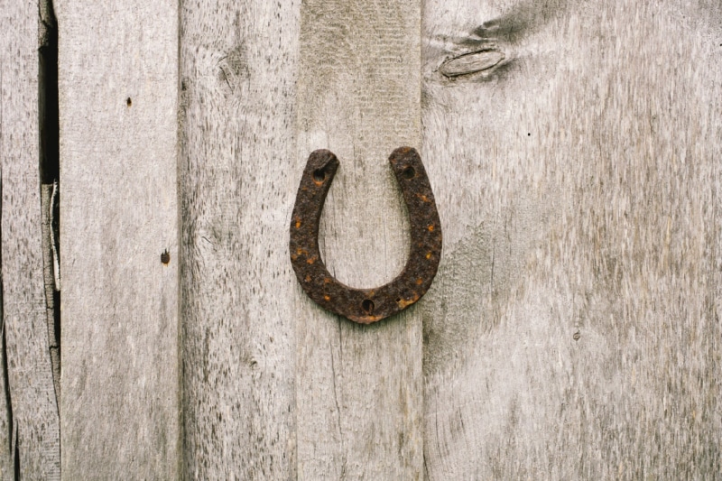 rough, building, doorknob, horseshoe, entrance, close-up, rusty, pattern, farm, wall - building feature, wall, old, luck, wooden, door knocker, outdoors