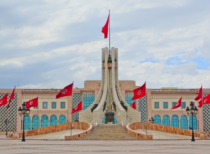 place, travel, nature, tunisia, red, sky, city, no people, day, building, tower, flags, cloud - sky, flag, built structure, tunis, government, monument