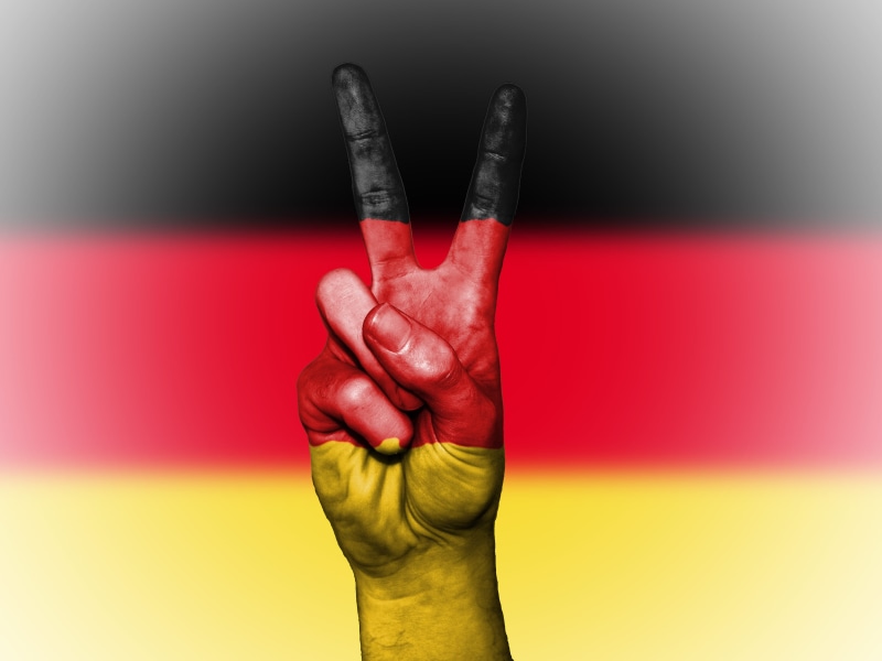 colored background, ensign, flag, tourism, copy space, human limb, thumb, country, banner, yellow, fingernail, one person, indoors, human body part, close-up