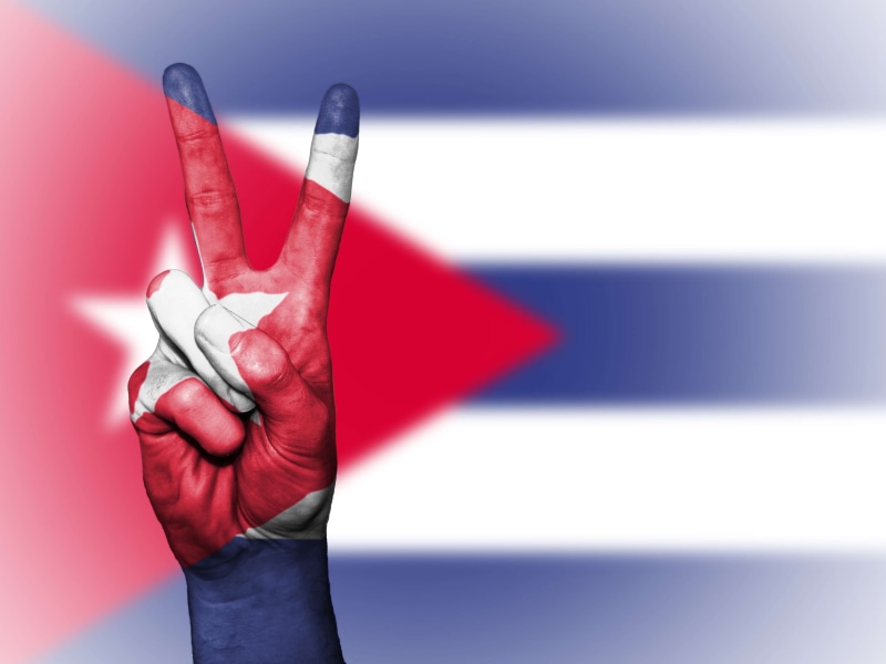 banner, icon, graphic, nation, body part, sign, studio shot, cuba, holding, flag, human hand, state, copy space, indoors, adult, background, travel, ensign