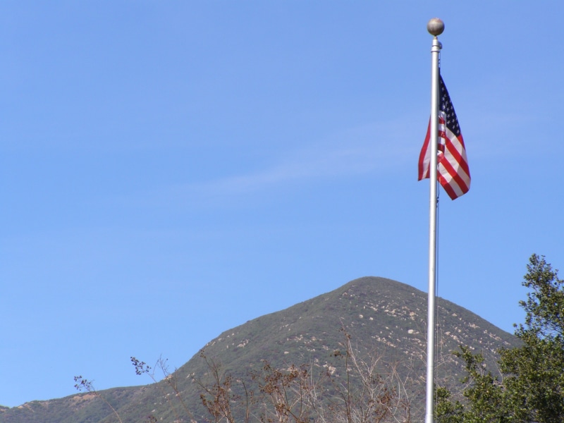 scenics - nature, national, sky, celebration, us, mountain range, fourth, national icon, flag, pole, banner, low angle view, stripes, no people, america