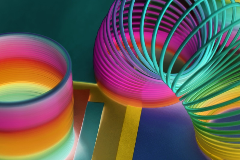 spring toy, slinky, entertainment, variation, toy, spiral, art and craft, choice, purple, fun, close-up, coil, funky, background, illustration, motion