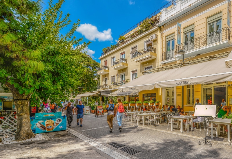 plant, cafe, sunny, Greece, summer, street, building exterior, mediterranean, adult, City, outdoors, nature, restaurant, building, group of people, holiday