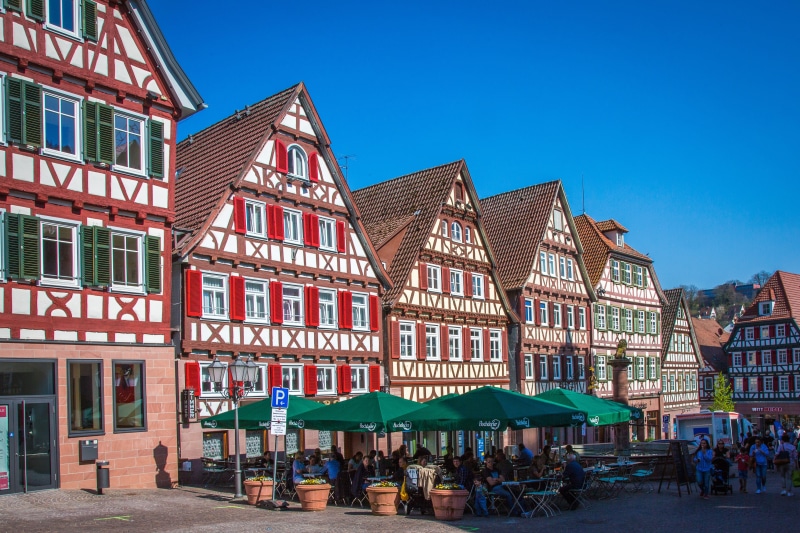 day, clear sky, cafe, outdoors, Middle Ages, incidental people, house, sky, Truss, building exterior, facade, street, table, nature, building, built structure
