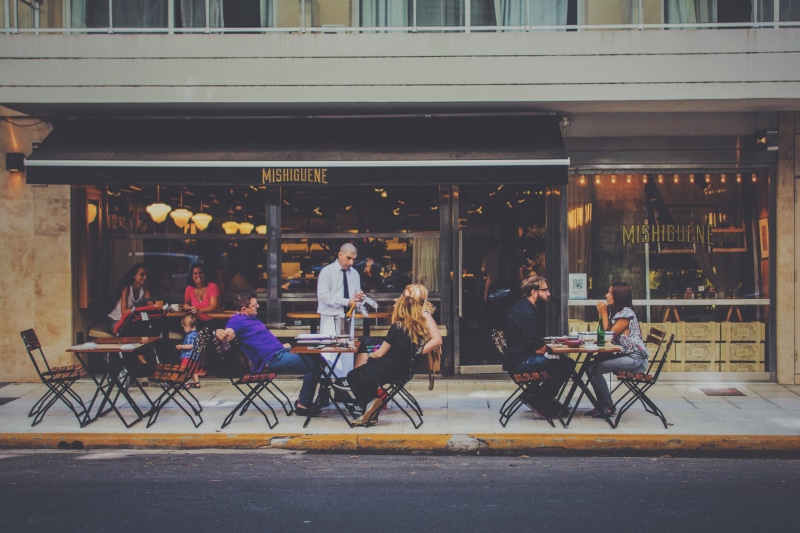 leisure activity, real people, restaurant, argentina, person, lunch, leisure, beside, front, using laptop, outdoors, city, street, window, street cafe