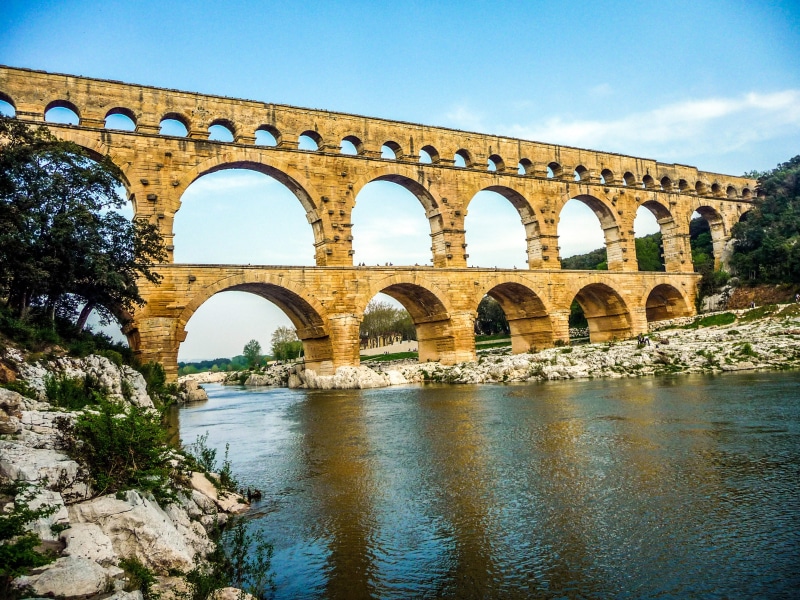 arched, day, bridge, columns, travel destinations, history, france, 2K, architectural column, nature, plant, water, tree, outdoors, landmark, roman bridge