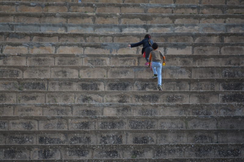 wall, tunisia, youth, young, stairs, 4K, staircase, real people, brick, vitality, amphitheatre, full length, roman, clothing, outdoors, wall - building feature