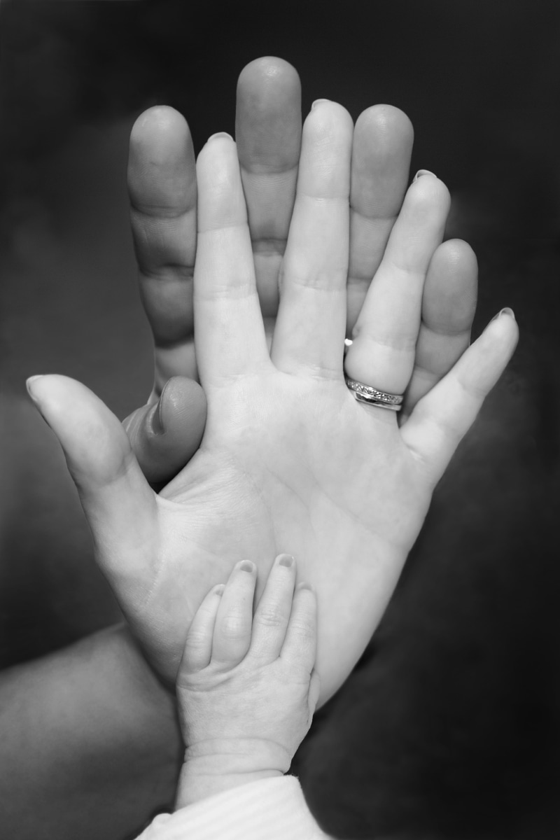 speaker, pregnancy, unrecognizable person, parents, baby, body part, new born, photo, personal perspective, hand, human body part, family, black background