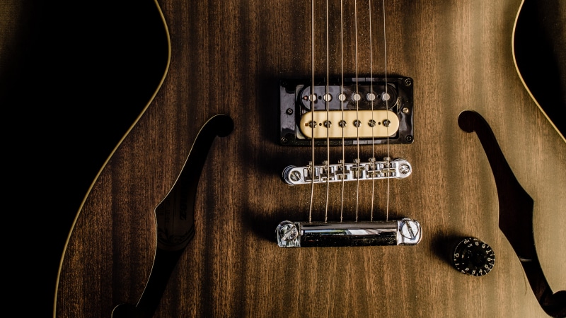 guitar, photography, music, studio shot, f-hole, indoors, communication, musician, musical equipment, strings, brown, capital letter, string instrument