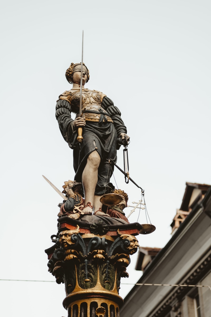holding, city, human representation, the past, white, balance, statue, history, sky, built structure, low angle view, architecture, art and craft, photography