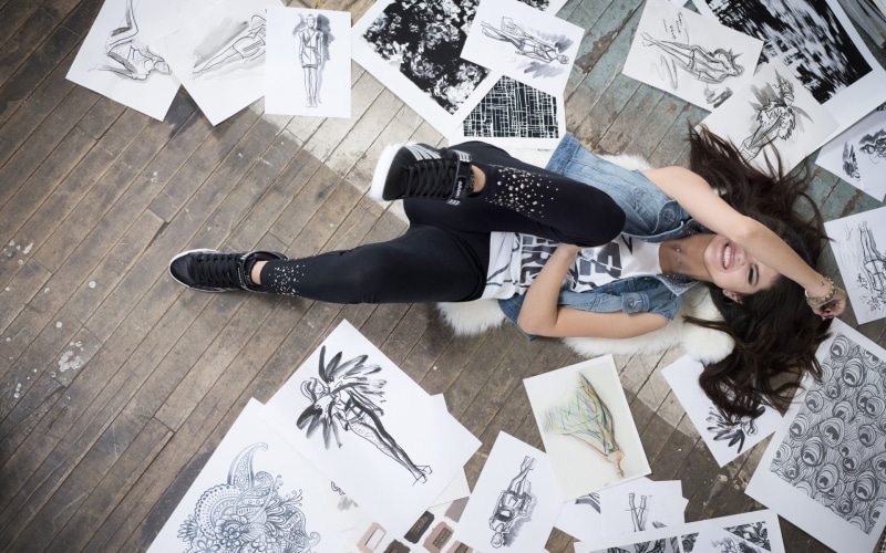paper, lying down, full length, celebrity, real people, leisure activity, indoors, drawing - art product, women, Selena Gomez, lifestyles, art and craft