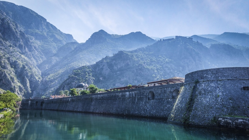 dam, mountain, europe, lake, kotor, day, tranquility, sky, no people, travel destinations, fortress, wall, mountain range, outdoors, built structure, naure