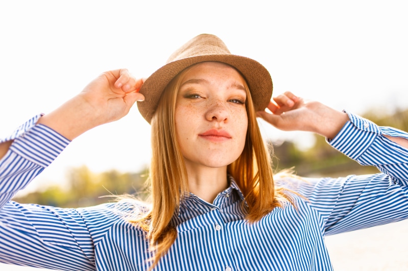 dress, person, brown, happy, front view, lifestyle, human limb, camera, hold, women, look, blue, outdoors, arms raised, hands, coffee, young women, freckles