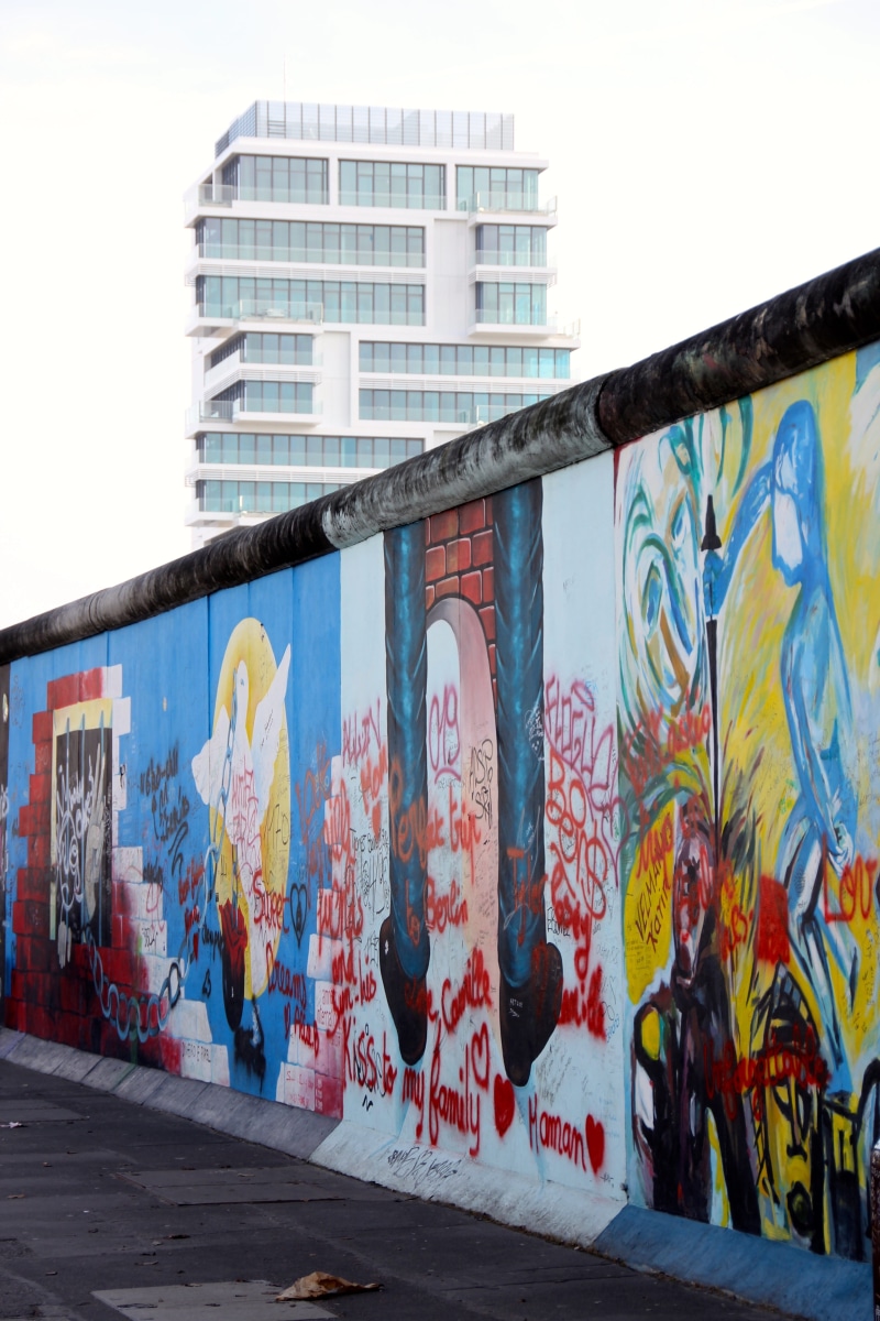 multi colored, painting, fragment, city, wall, Berlin Wall, outdoors, human representation, representation, building exterior, no people, wall - building feature