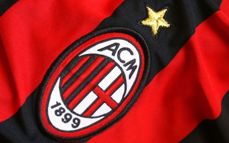 soccer clubs, textile, close-up, acm, insignia, soccer, logo, patriotism, pride, uniform, red, studio shot, sports jerseys, black, badge, symbol, shape