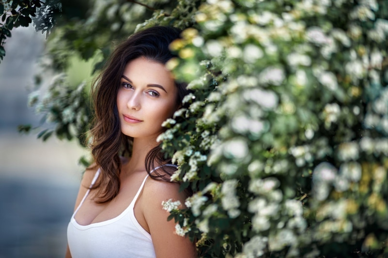 1080P, model, tank top, looking at viewer, face, plants, long hair, portrait, women, brunette, wavy hair, Kamila Nováková, depth of field, Milan R