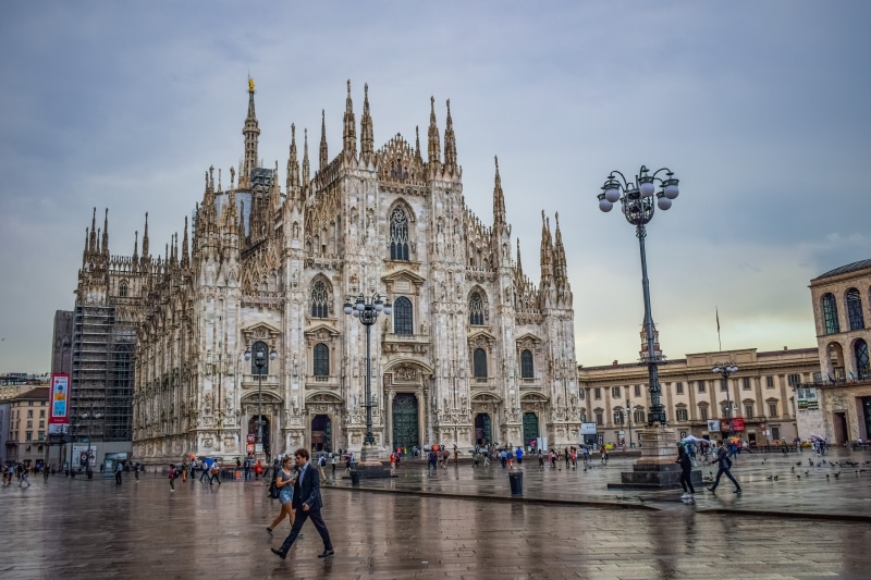 city, building exterior, spirituality, lombardy, crowd, tourism, old, travel destinations, religion, milano, belief, group of people, downtown, rainy day
