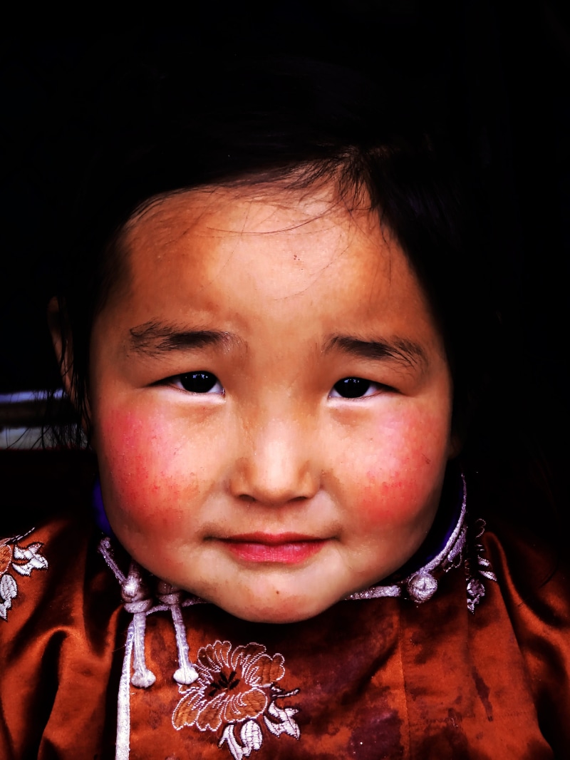 indoors, Mongolia, one person, women, traditional dress, childhood, floral pattern, looking at camera, portrait, headshot, smiling, Nomadic, 4K, children only