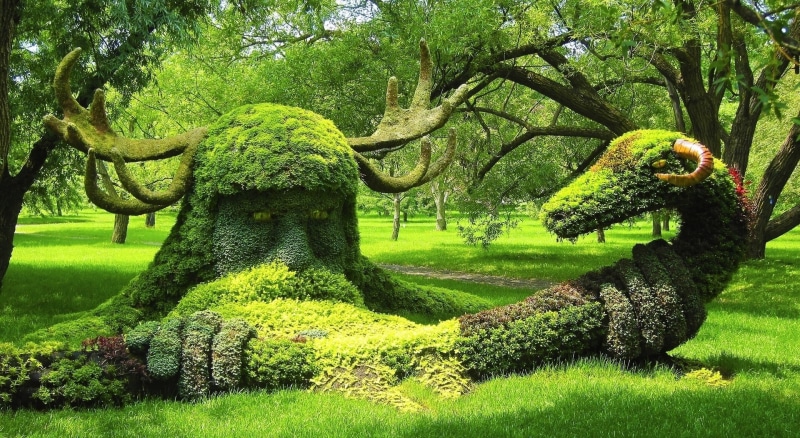 hedge, spirits, outdoors, grass, animal representation, topiary, green color, representation, park - man made space, wood, garden, Quebec, tree, warrior
