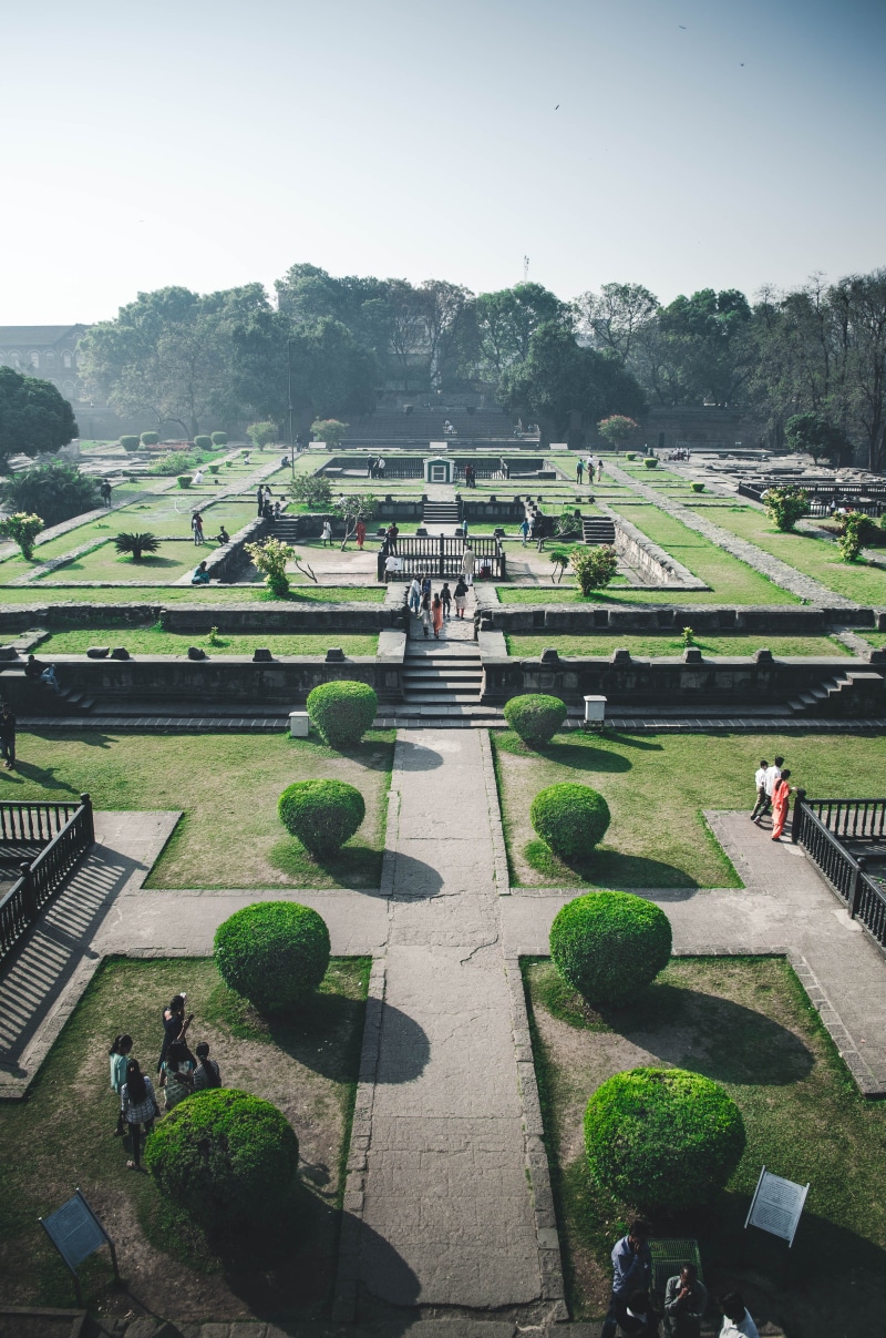 men, day, outdoors, large group of people, man made, hedge, monument, shaniwar wada fort, green color, group of people, peace, formal garden, plant, nature