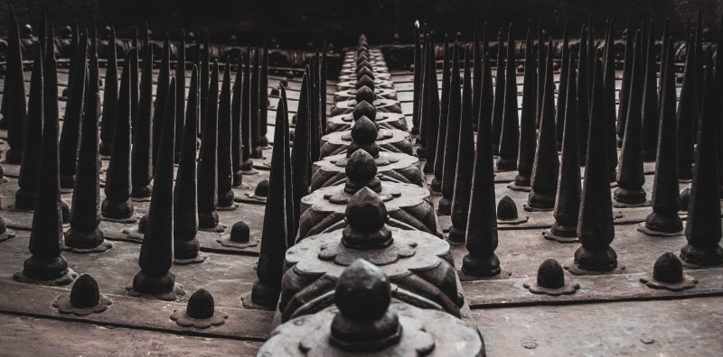 door, creativity, line, brown, representation, nature, dark, pattern, linear, fort, belief, spikes, religion, art and craft, day, rocks, no people, wood - material