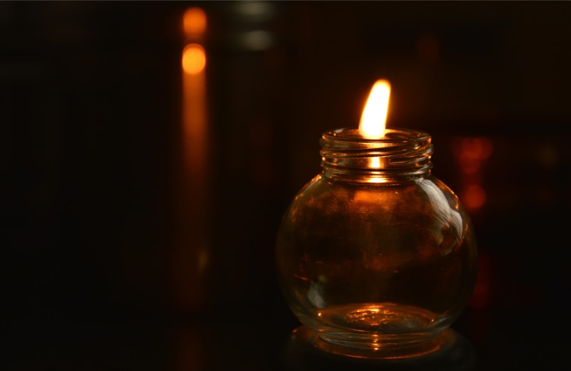 india, dark, glowing, oil lamp, indoors, transparent, single object, fire, pune, candle, glass, no people, maharashtra, heat - temperature, focus on foreground