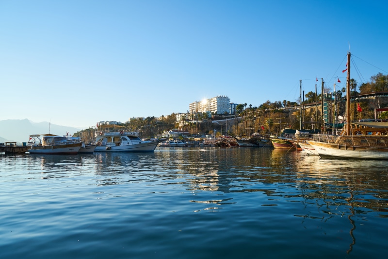 cityscape, houses, 8K, yacht, building exterior, sky, moored, reflection, harbor, water, marina, marine, passenger craft, built structure, port, boats