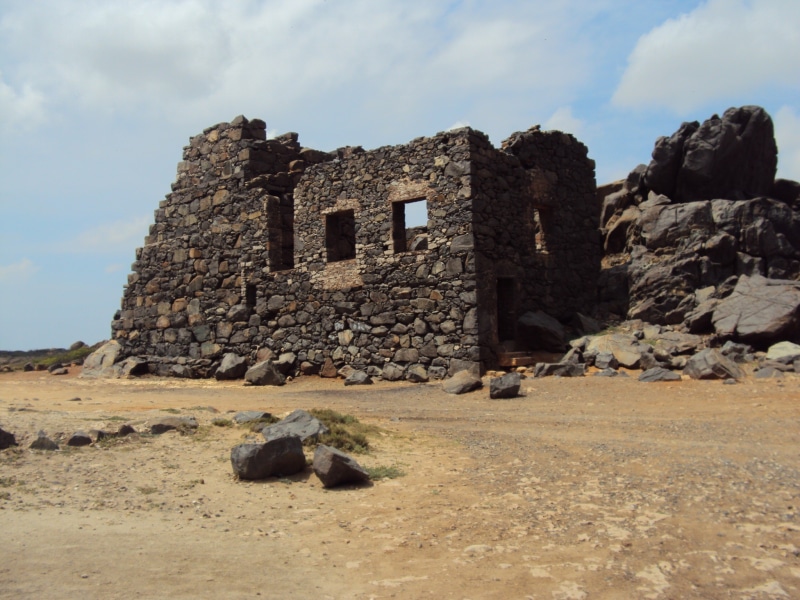 built structure, no people, sky, arid climate, stone, ancient, island, rock - object, old ruin, stone wall, ruined, abandoned, land, building exterior