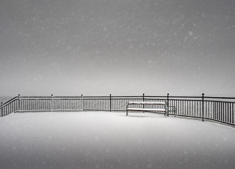 bridge - man made structure, railing, day, outdoors, near, gmunden, beauty in nature, bridge, snowing, bench, horizon over water, built structure, scenics