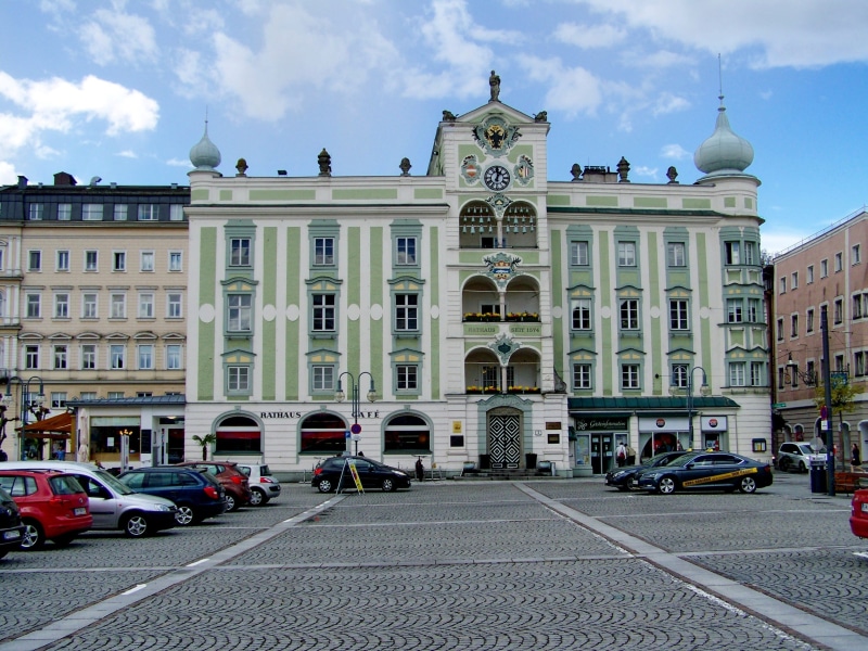 travel, architecture, mode of transportation, street, road, city, travel destinations, built structure, city hall building, motor vehicle, incidental people