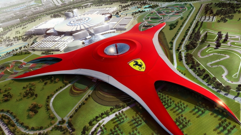 toy, no people, close-up, wheel, retro styled, red, mode of transportation, day, outdoors, Abu Dhabi, land vehicle, motor vehicle, Ferrari World, green color