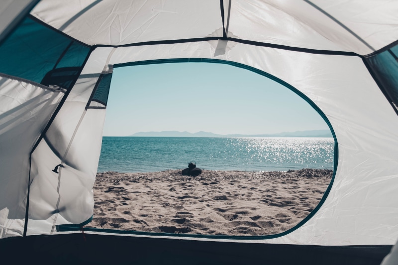 mountain tent, water, inflatable, white, travel, human, porthole, daytime, art, grey, sand, window, mode of transportation, person, day, sunlight, beach