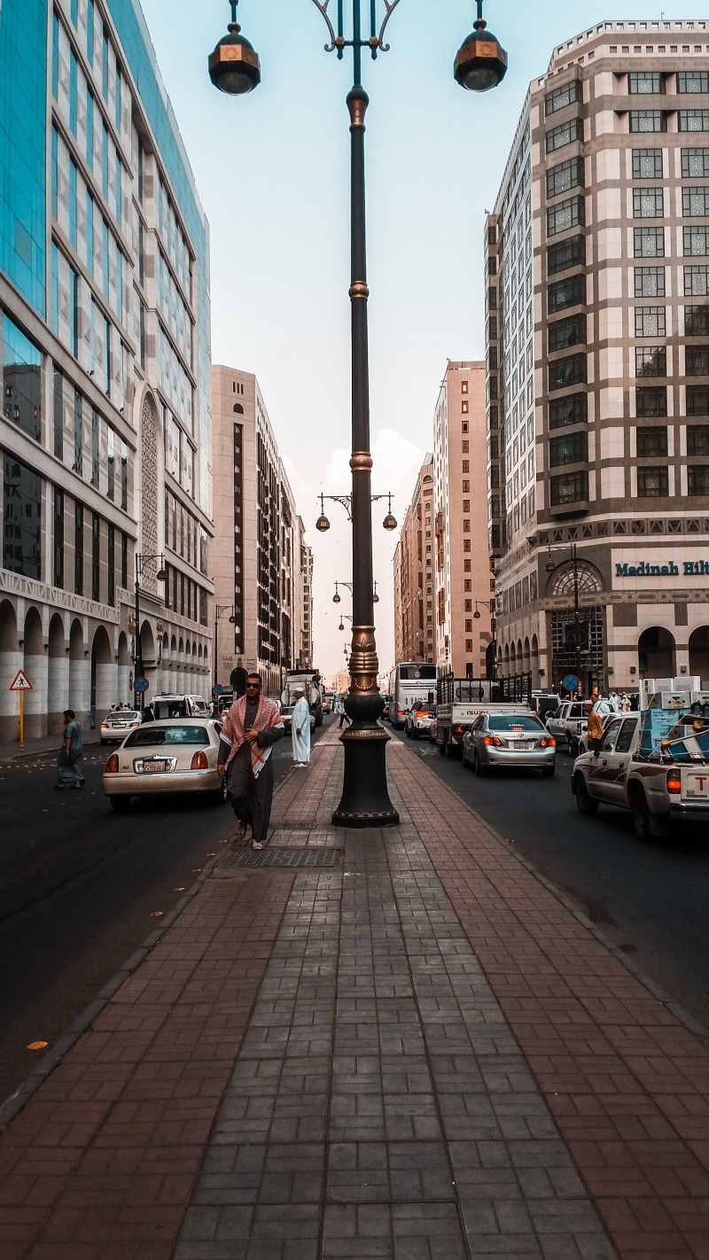 city street, medina, transportation, road, street light, old city, badaah, people, old film, city, land vehicle, vintage, built structure, life, sky, motor vehicle