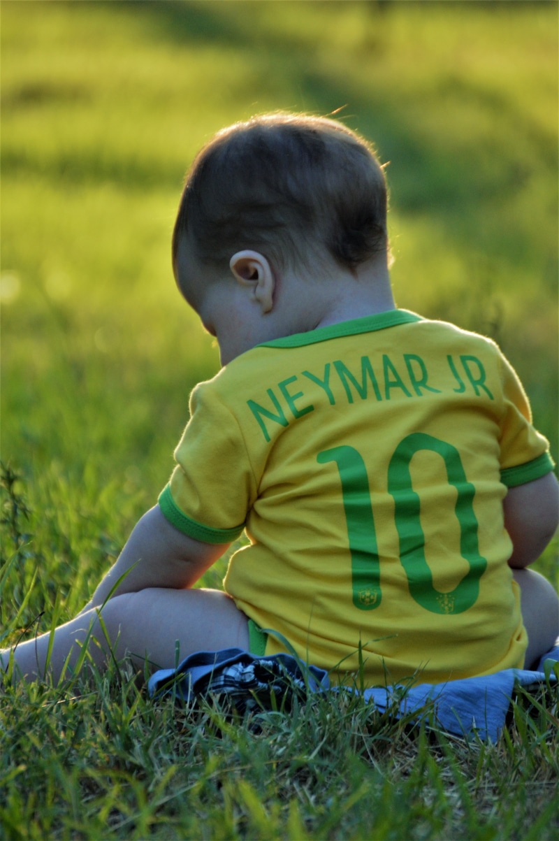 sitting, casual clothing, ipanema, plant, adorable, 5K, men, neymar jr, blond, brazil, fun, hair, leaf, love, baby, leaves, grass, joy, football, child