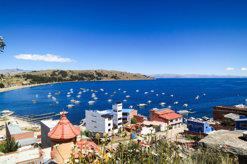 city, bay, beside, residential district, town, outdoors, built structure, coast, high angle view, buildings, mountain, copacabana, no people, blue, building