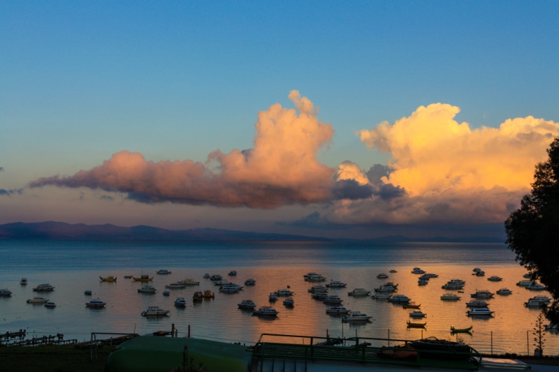 scenics - nature, water, outdoors, sunset, horizon over water, boats, no people, plant, transportation, cloud - sky, tree, nautical vessel, lake titicaca