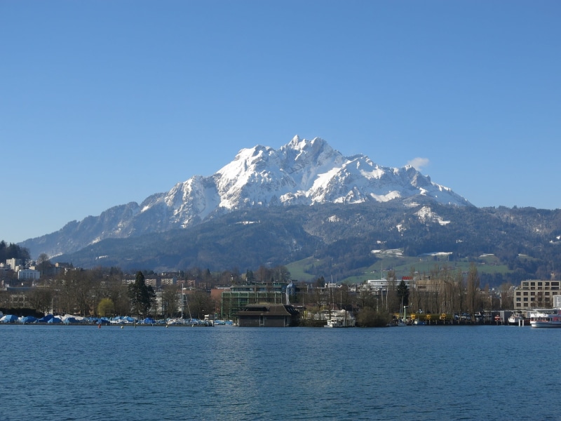 Water, lake, Scenic, city, no people, view into land, scenics - nature, beauty in nature, outdoors, sunny, clear sky, mountain, tourist, building, travel