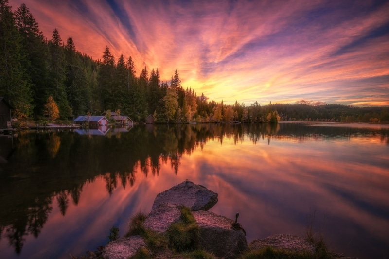 reflection lake, non-urban scene, forest, water, reflection, orange color, tranquility, boathouses, hills, calm waters, cloud - sky, landscape, plant, sky