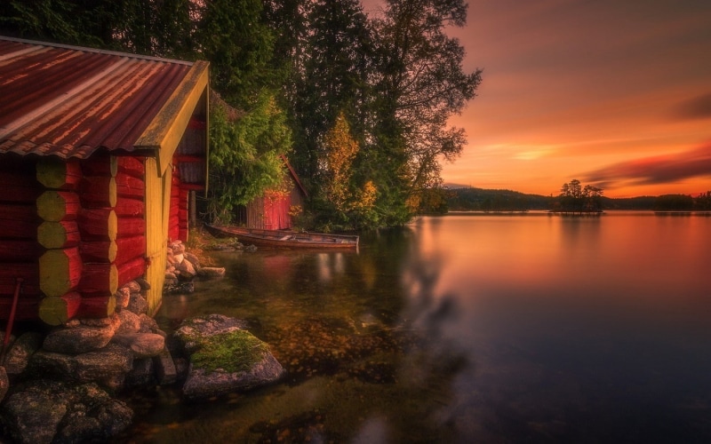 trees, hills, clouds, built structure, non-urban scene, no people, landscape, beauty in nature, outdoors, fall, tree, scenics - nature, boathouses, reflection