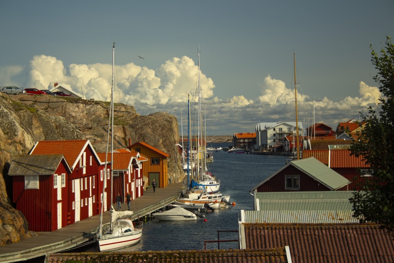 cliffs, architecture, west coast, transportation, sea, day, cloud - sky, mode of transportation, boathouses, boats, residential district, sailboat, outdoors