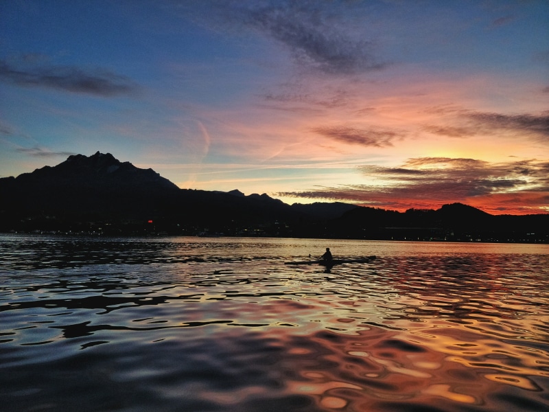 tranquility, scenics - nature, pilatus, 4K, sports, beauty in nature, nature, lake lucerne, waterfront, sunset, rowing, one person, sea, orange color