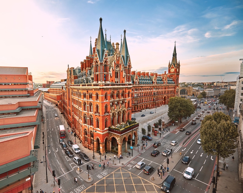 concrete, vehicle, metropolis, brown, automobile, building exterior, building, town, st pancras, person, outdoors, mode of transportation, sky, town square
