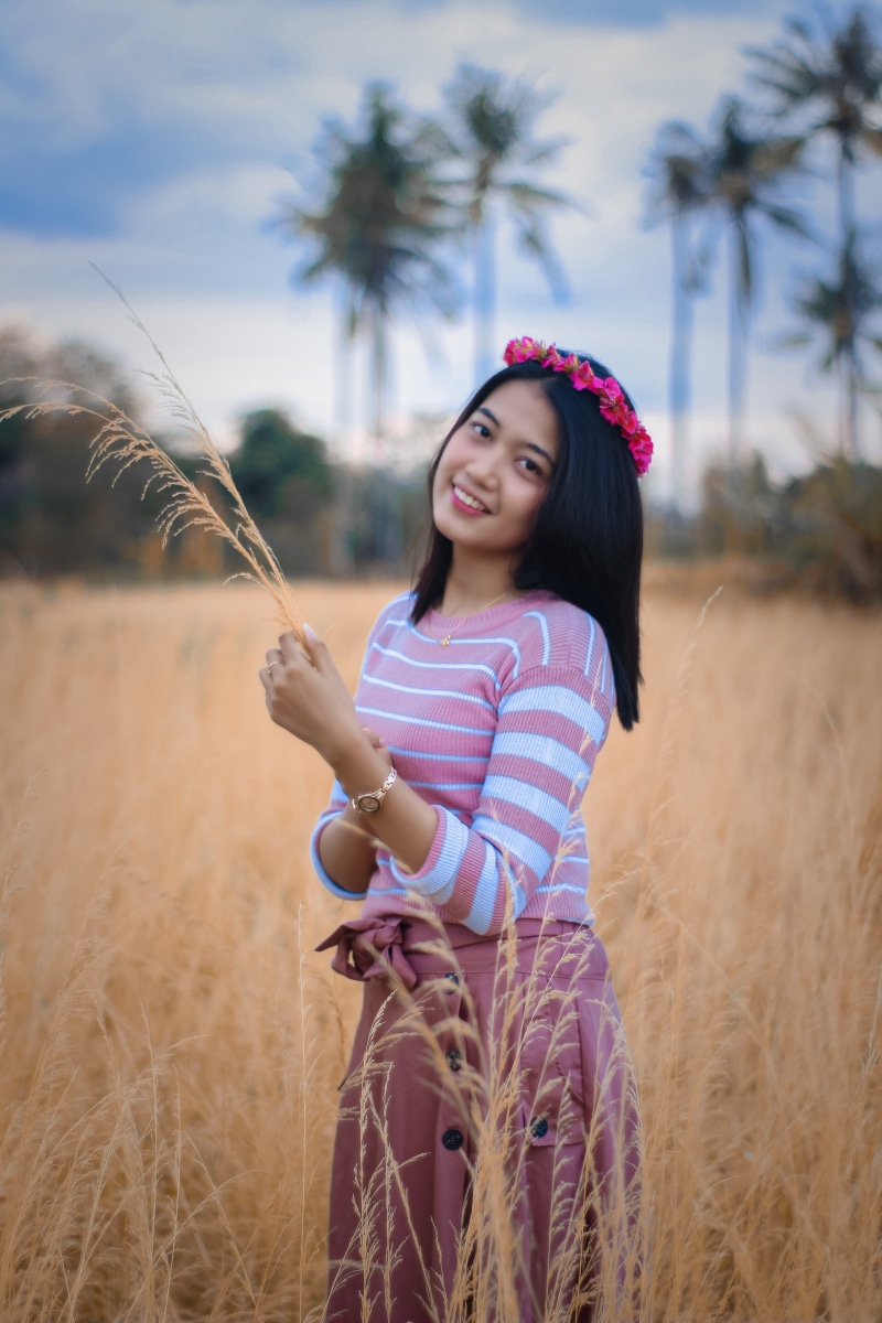 innocence, hairstyle, casual clothing, beauty, three quarter length, outdoors, field, standing, plant, land, indonesian, portrait, child, beautiful woman