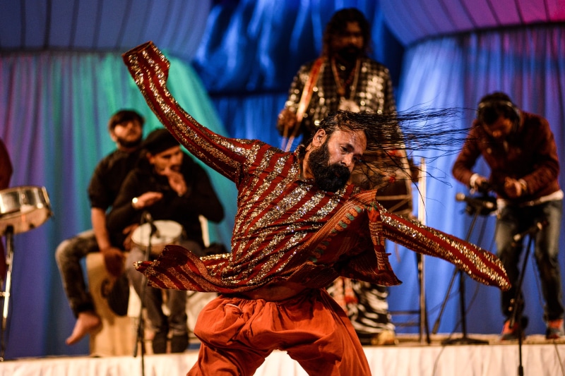 motion, Turkish, whirling, Religion, performing arts event, performance, indoors, arms raised, celebration, human arm, dancing, man, limb, costume, nightlife