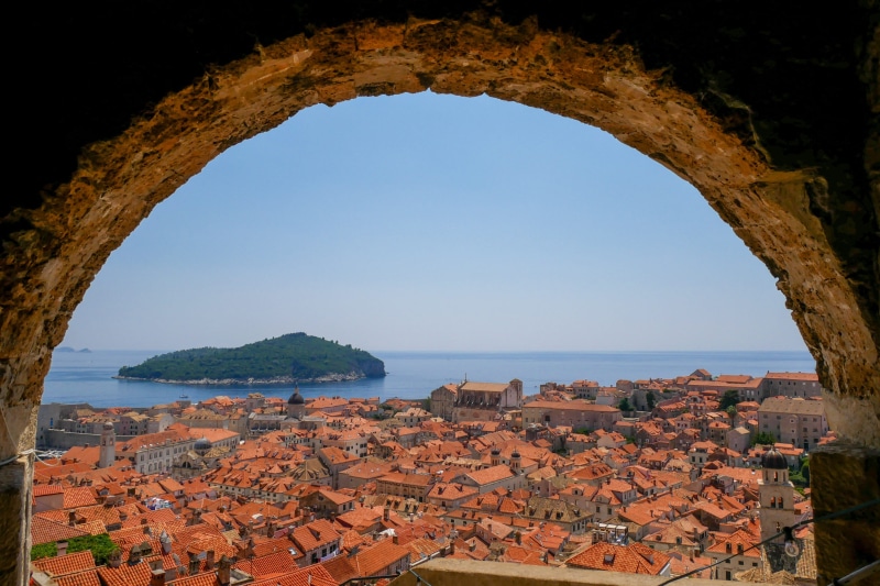 residential district, horizon over water, travel destinations, history, tourism, fortress, city, roof, architecture, no people, blue, built structure, building exterior