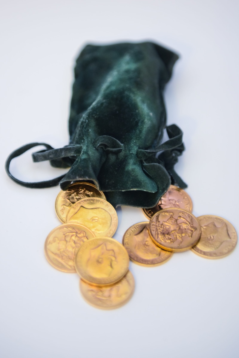 toy, food and drink, table, indoors, studio shot, close-up, high angle view, Money, food, white background, gold, selective focus, group of objects, snack
