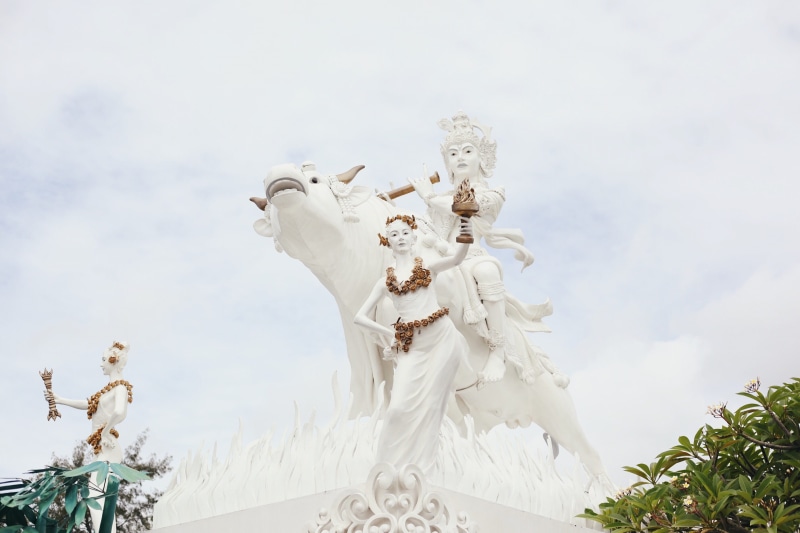 low angle view, day, male likeness, creativity, krishna, religion, outdoors, spirituality, representation, sculpture, statue, radha, white color, human representation
